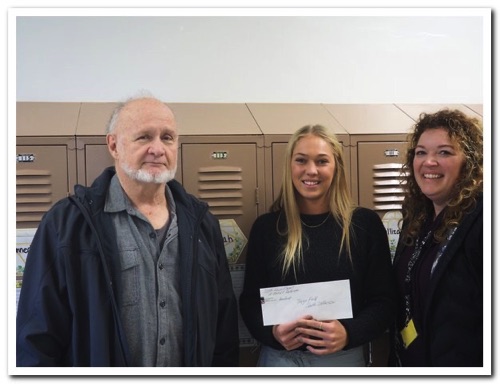 Teryn Field, an elementary teacher at the Mannsville Elementary Building, andSarah
Morris, President of the South Jefferson Teachers Association with President Hunneyman (L).